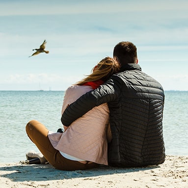 Couple sitting on the sound in Connecticut, thinking about couples therapy in Westport, Norwalk, Darien, Fairfield