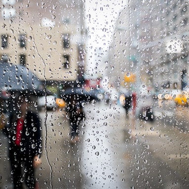 Rainy street in New York City representing anxiety and depression therapy online in Connecticut, including Norwalk, Darien, Westport, Stamford, Bridgeport
