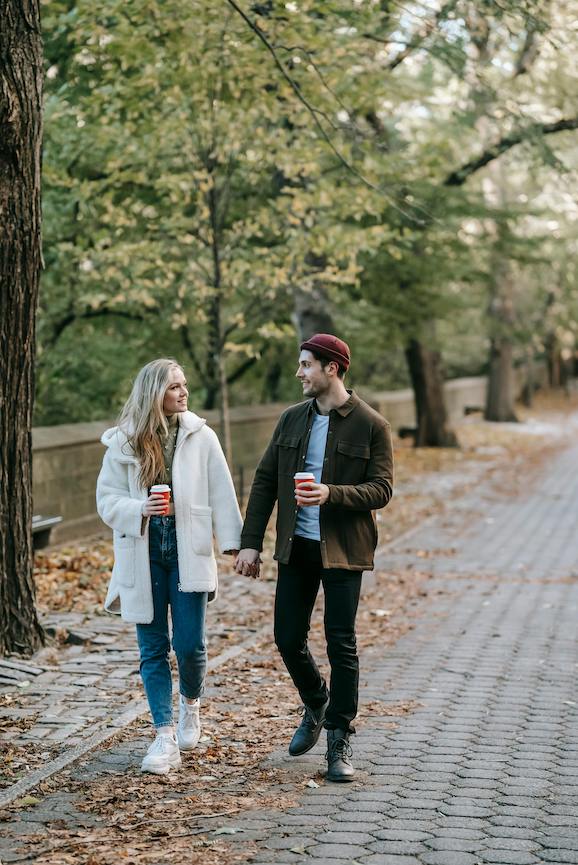 Couple walking in the park holding hands