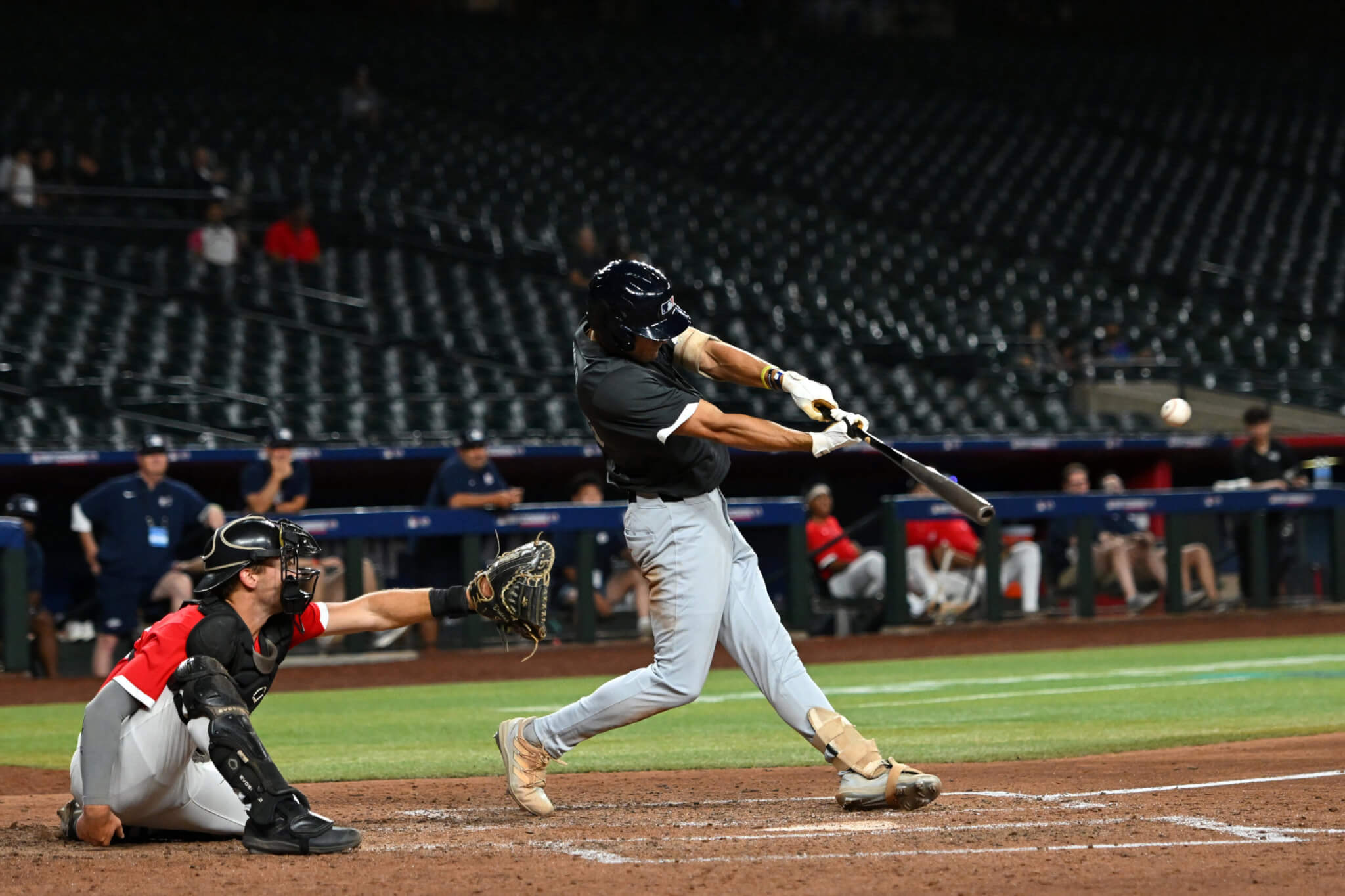 baseball player Focused baseball player hitting a home run
